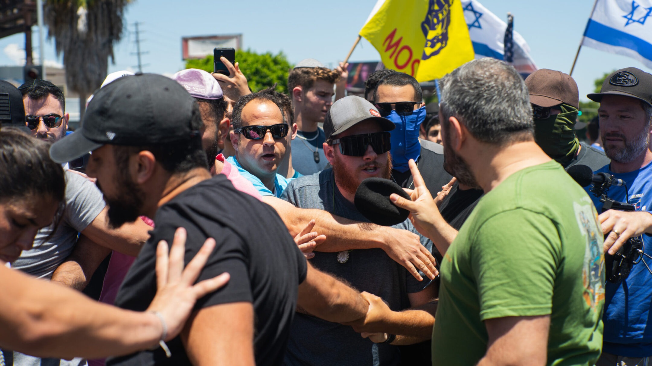 Pro-Palestinian and pro-Israel protesters clash outside a synagogue in Los Angeles, June 23, 2024. (Shay Horse/NurPhoto via Getty Images)