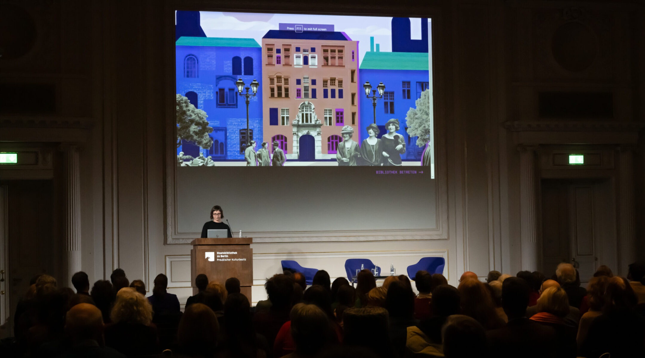 Bettina Farack, a research fellow at the Leo Baeck Institute in Jerusalem, speaks about the Library of Lost Books initiative during a launch event in Berlin in November 2023. (Courtesy Weiner Library)