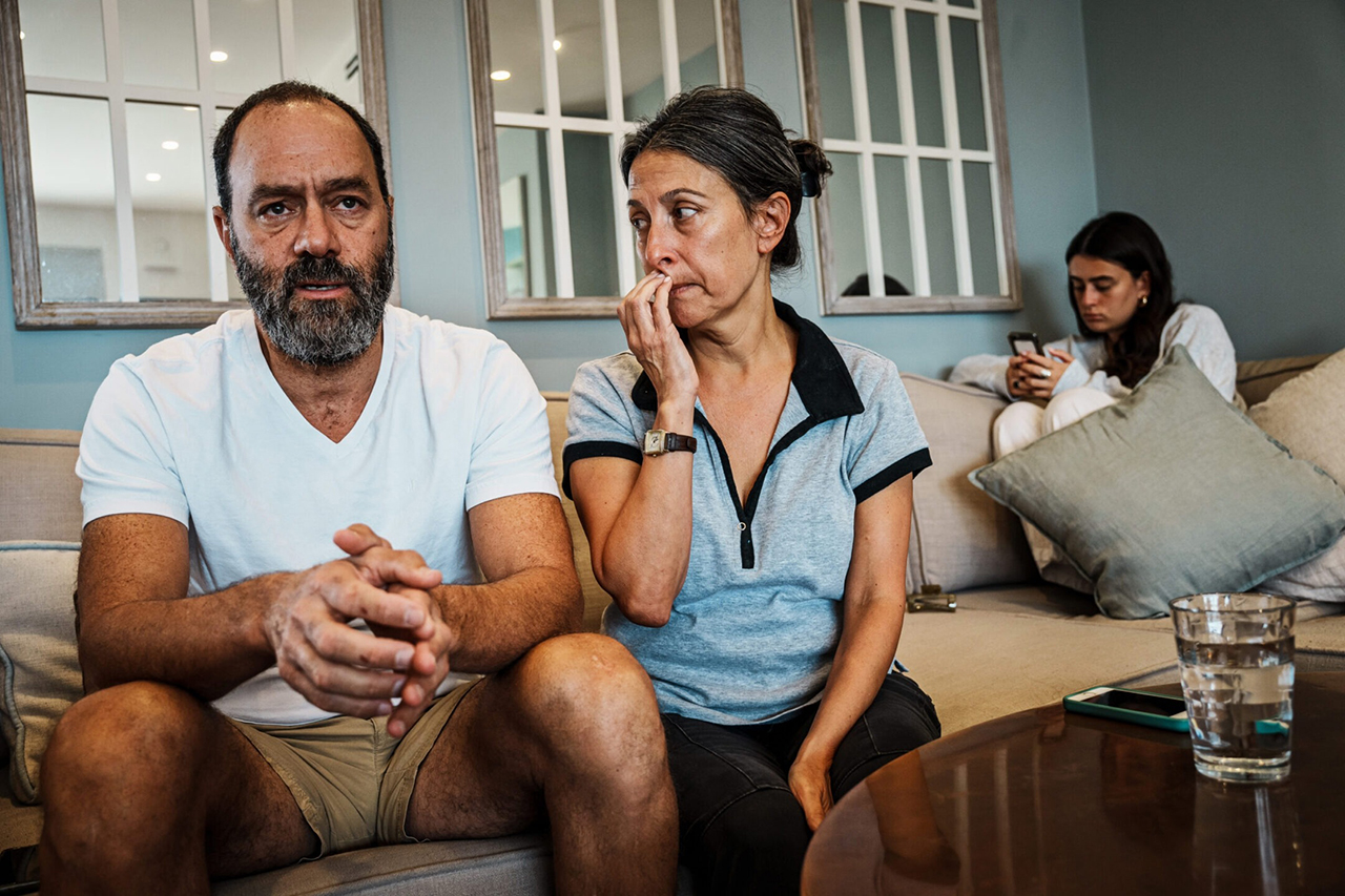 Jonathan Polin amd Rachel Goldberg recount their last interactions with their missing son Berkeley-born Hersh Goldberg-Polin, 23, who  was taken hostage by Hamas on Oct. 7, while family members and friends show up to support them at their home in Jerusalem, Oct. 10, 2023. (Marcus Yam/Los Angeles Times via Getty Images)
