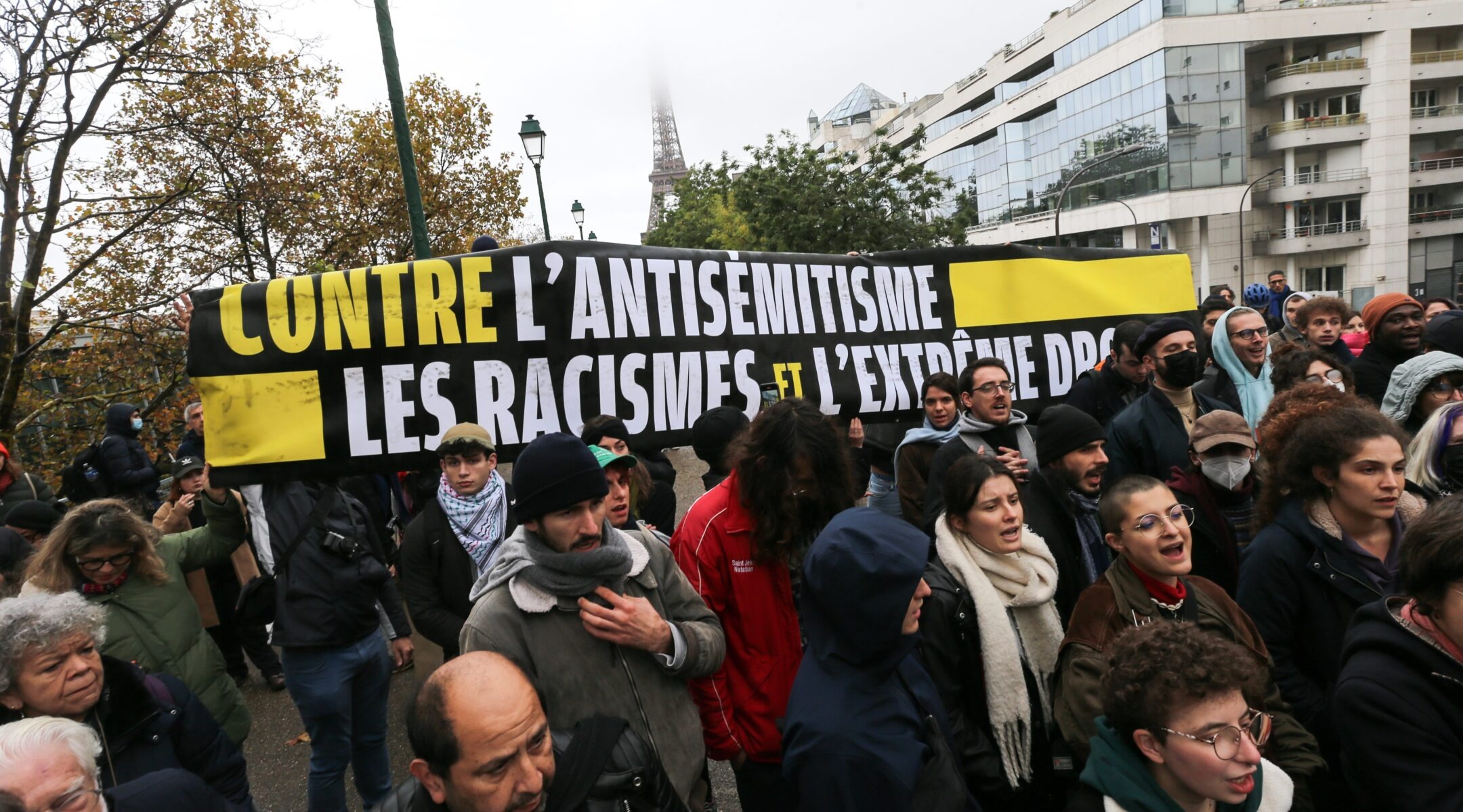 Demonstrators carry a banner reading "Against antisemitism, racism and the extreme right" during a rally at the Square des Martyrs Juifs in Paris, Nov. 12, 2023. (Michel Stoupak/NurPhoto via Getty Images)