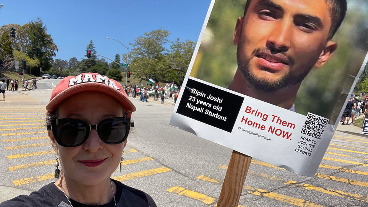 Anastasia Torres-Gil holds up a sign demanding the return of Bipin Joshi, a 23-year-old man from Nepal who is among the hostages still being held in Gaza, at a May 20, 2024 protest at UC Santa Cruz. (Courtesy Torres-Gil)
