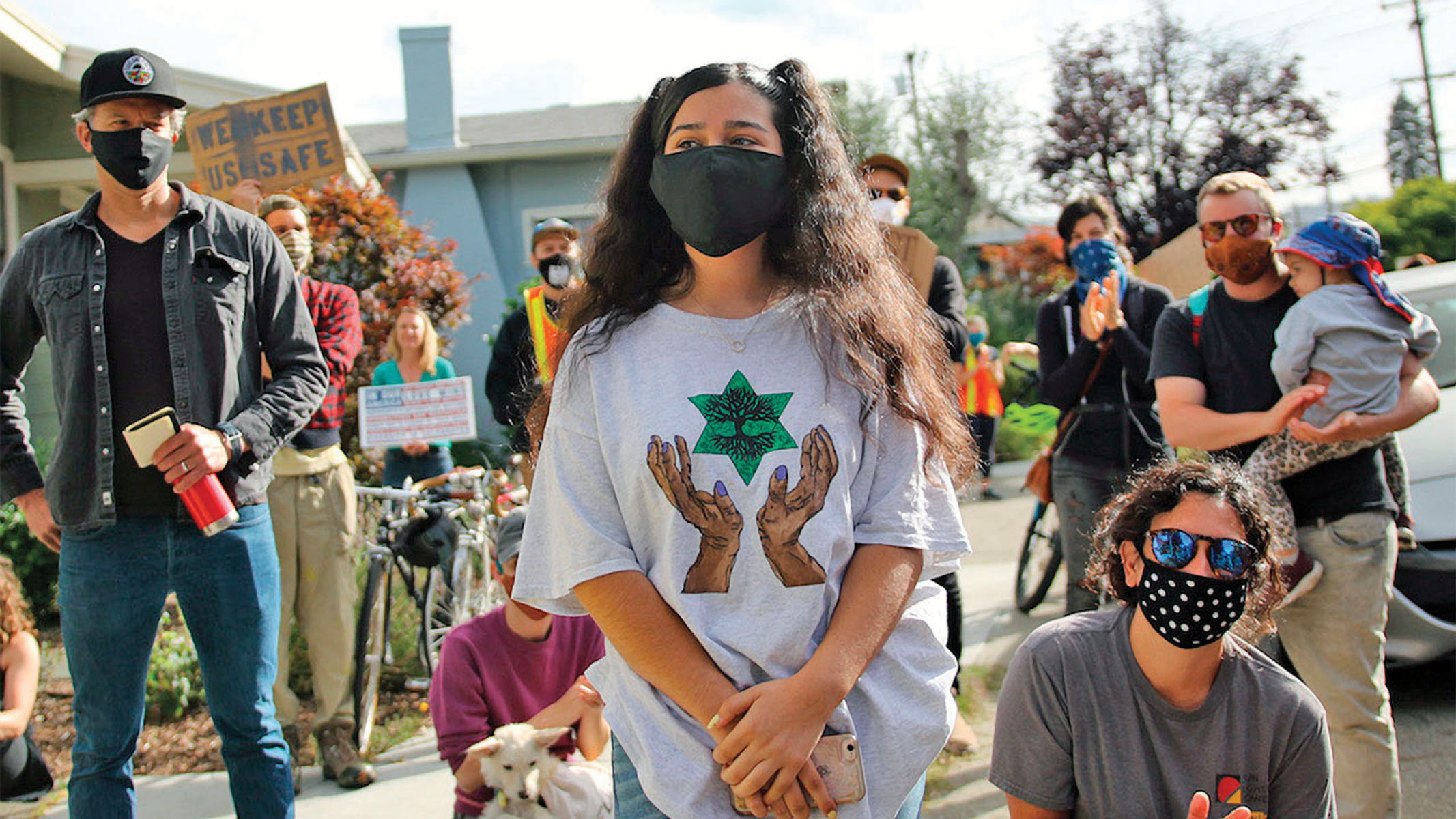 a teen girl wears a t-shirt with a graphic of a pair