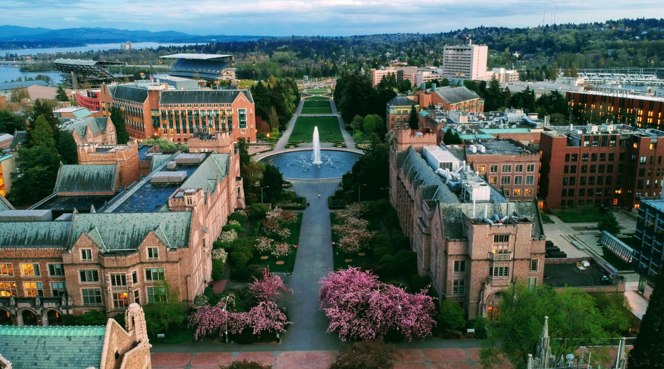 Overhead shot of a cluster of buildings with a fountain in the center