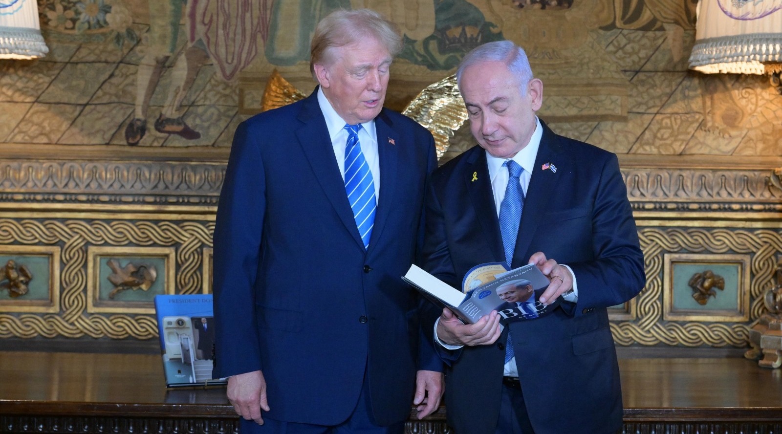 Israeli Prime Minister Benjamin Netanyahu shares his autobiography with then-former President Donald Trump  at Trump's estate, Mar-a-Lago, Palm Beach, Florida, July 26, 2024. (Amos Ben-Gershom/Israel Government Press Office)