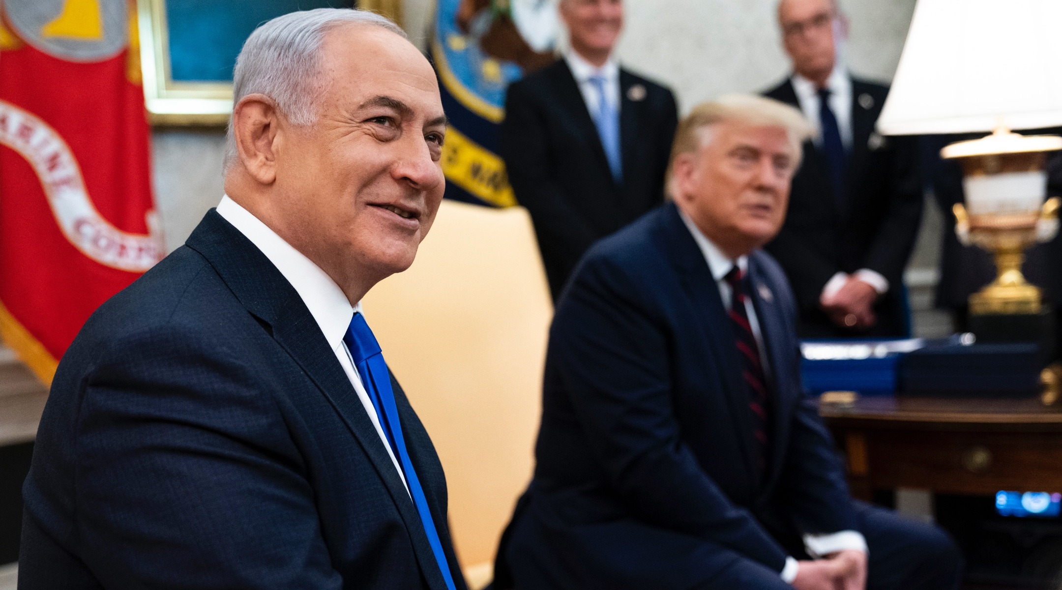 Netanyahu and Trump sit together smiling