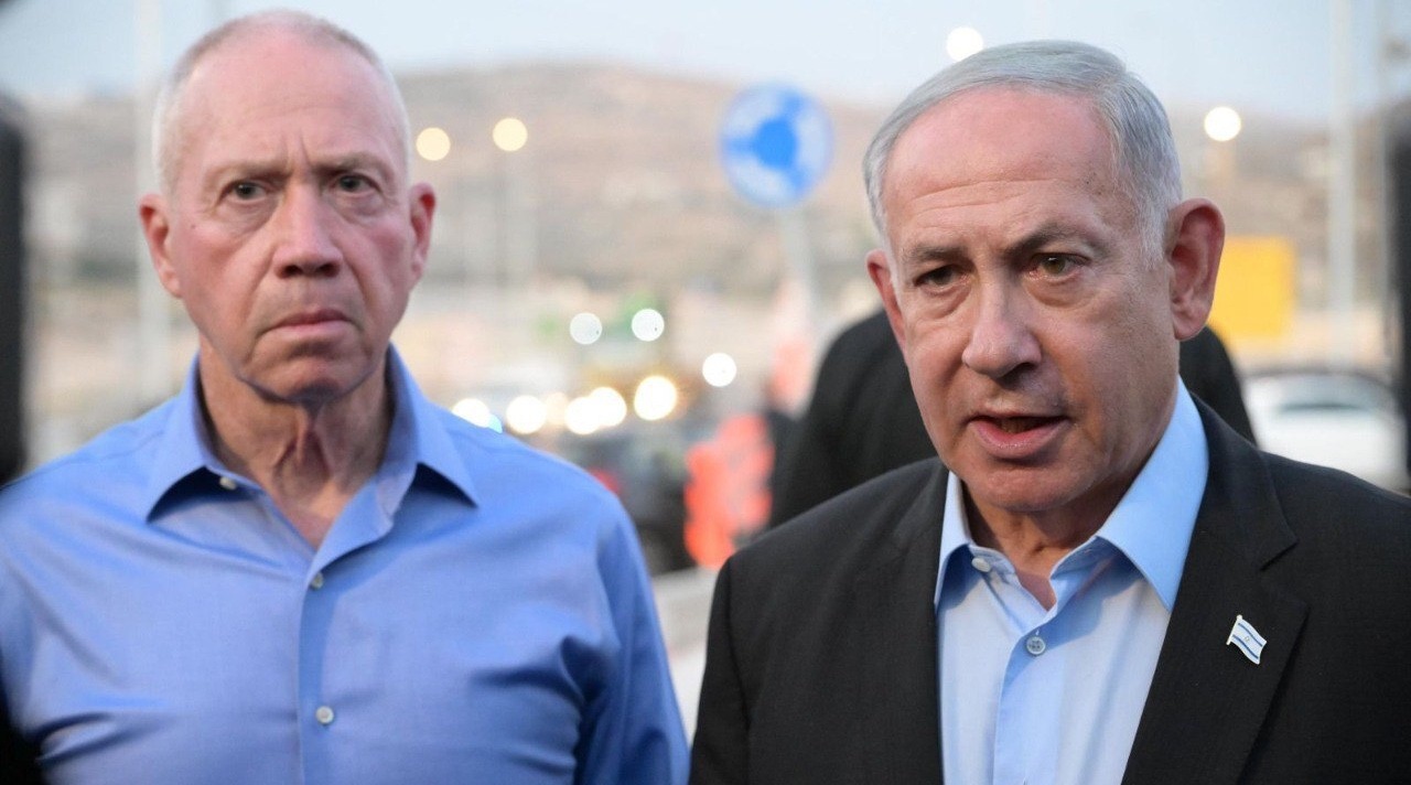 Israeli Prime Minister Benjamin Netanyahu, right, and then Israeli Defense Minister Yoav Gallant visit the site of the shooting where a settler was killed and another seriously injured in Hebron, Aug. 21, 2023. (Amos Ben-Gershom/GPO/ Handout/Anadolu Agency via Getty Images)