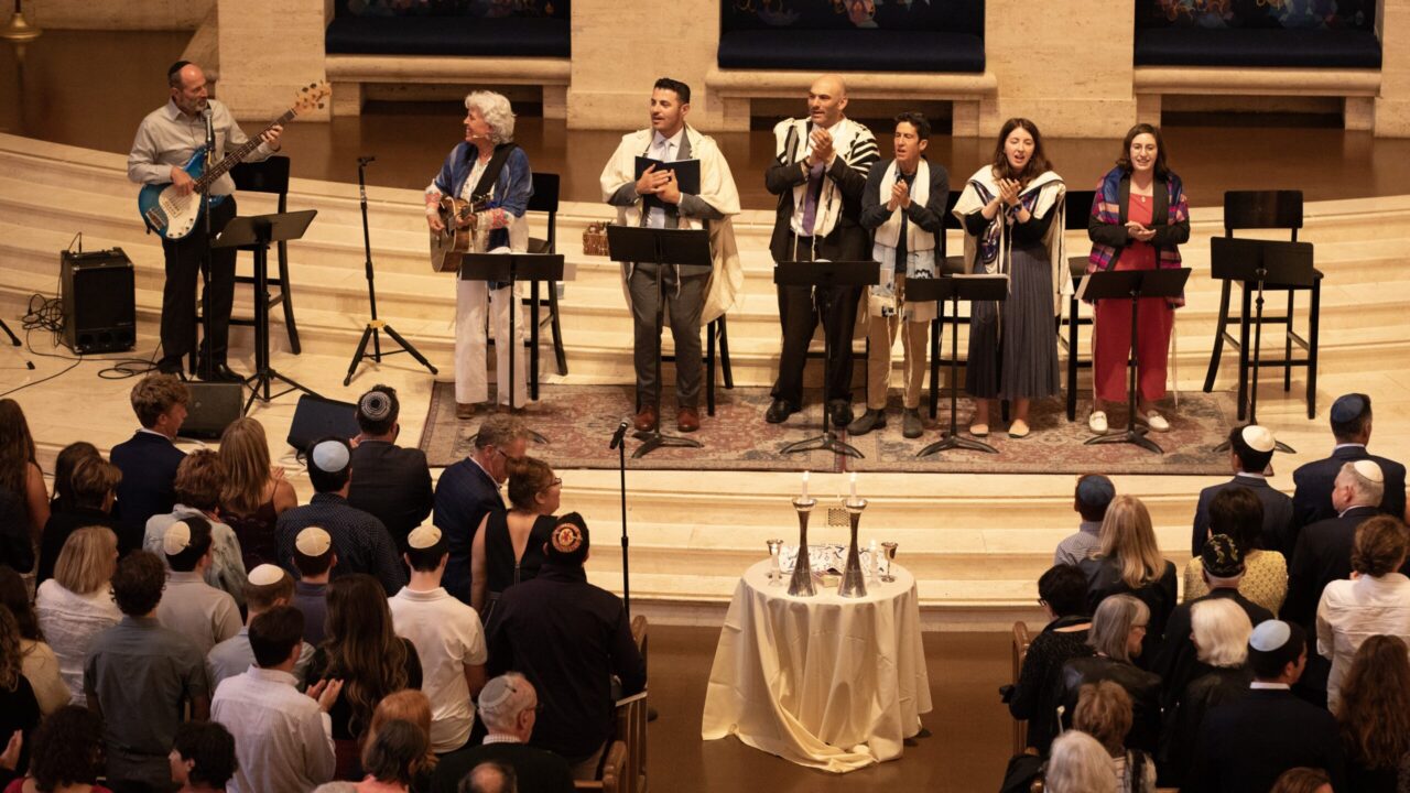 Emanu-El clergy lead the congregation in prayer. (Sasha Yevelev)