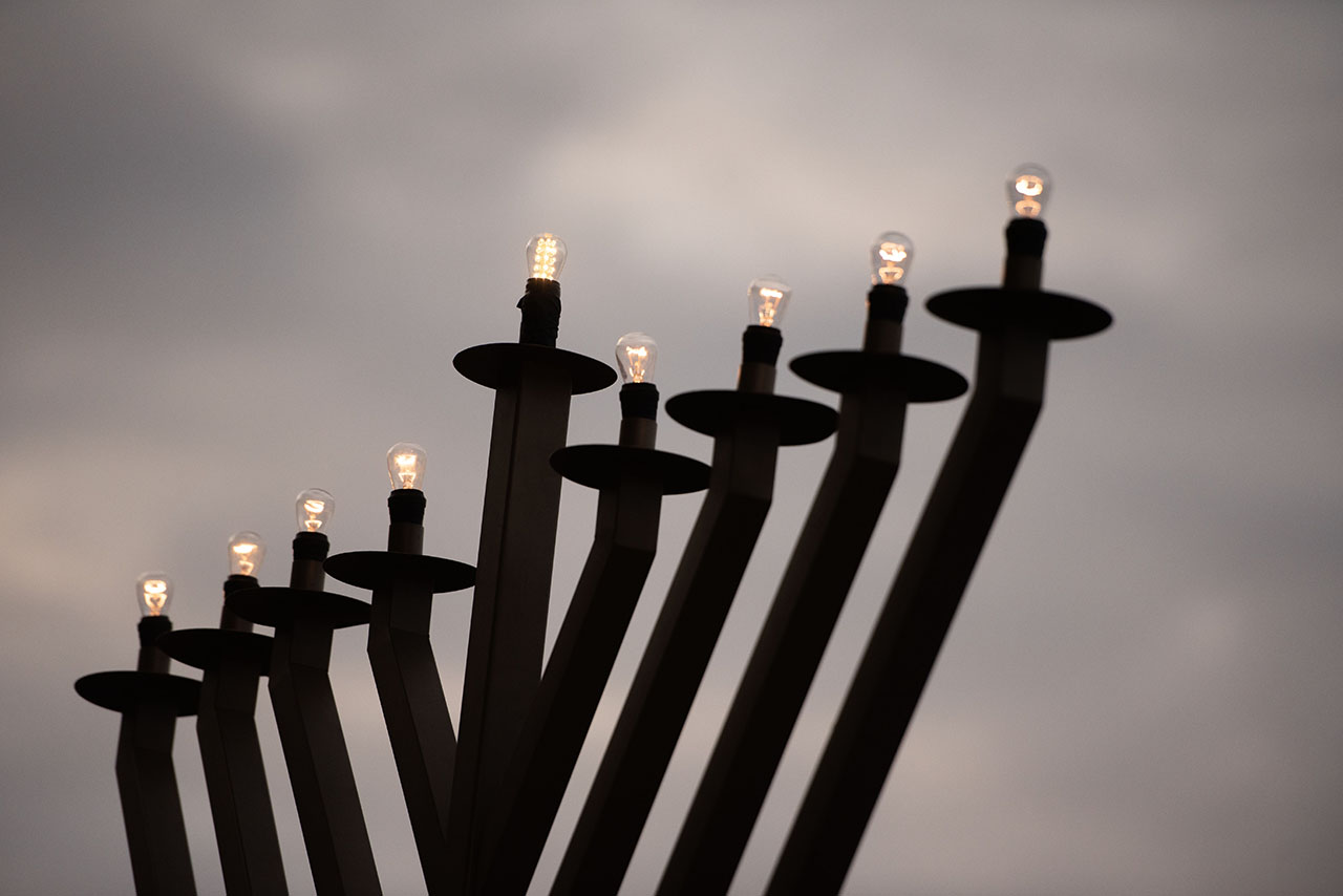 An electric menorah is lit up as JCCSF celebrates Hanukkah at Ghirardelli Square in San Francisco, Dec. 15, 2024. (Aaron Levy-Wolins/J. Staff)