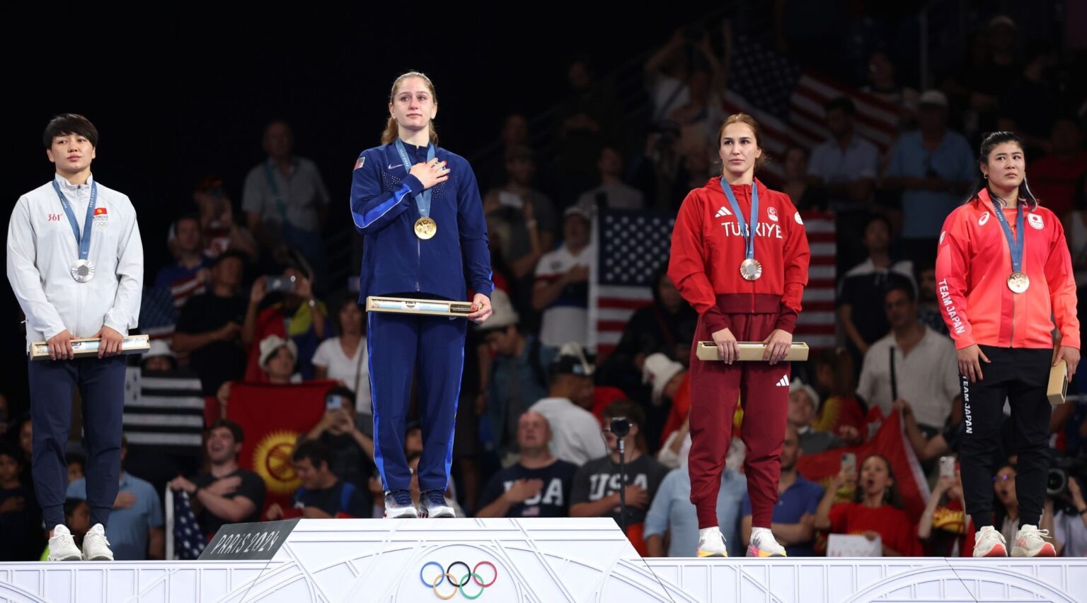 Gold medalist Amit Elor stands on the podium during the wrestling women’s freestyle 68kg medal ceremony of the Paris Olympic Games, Aug. 6, 2024. (Sarah Stier/Getty Images)