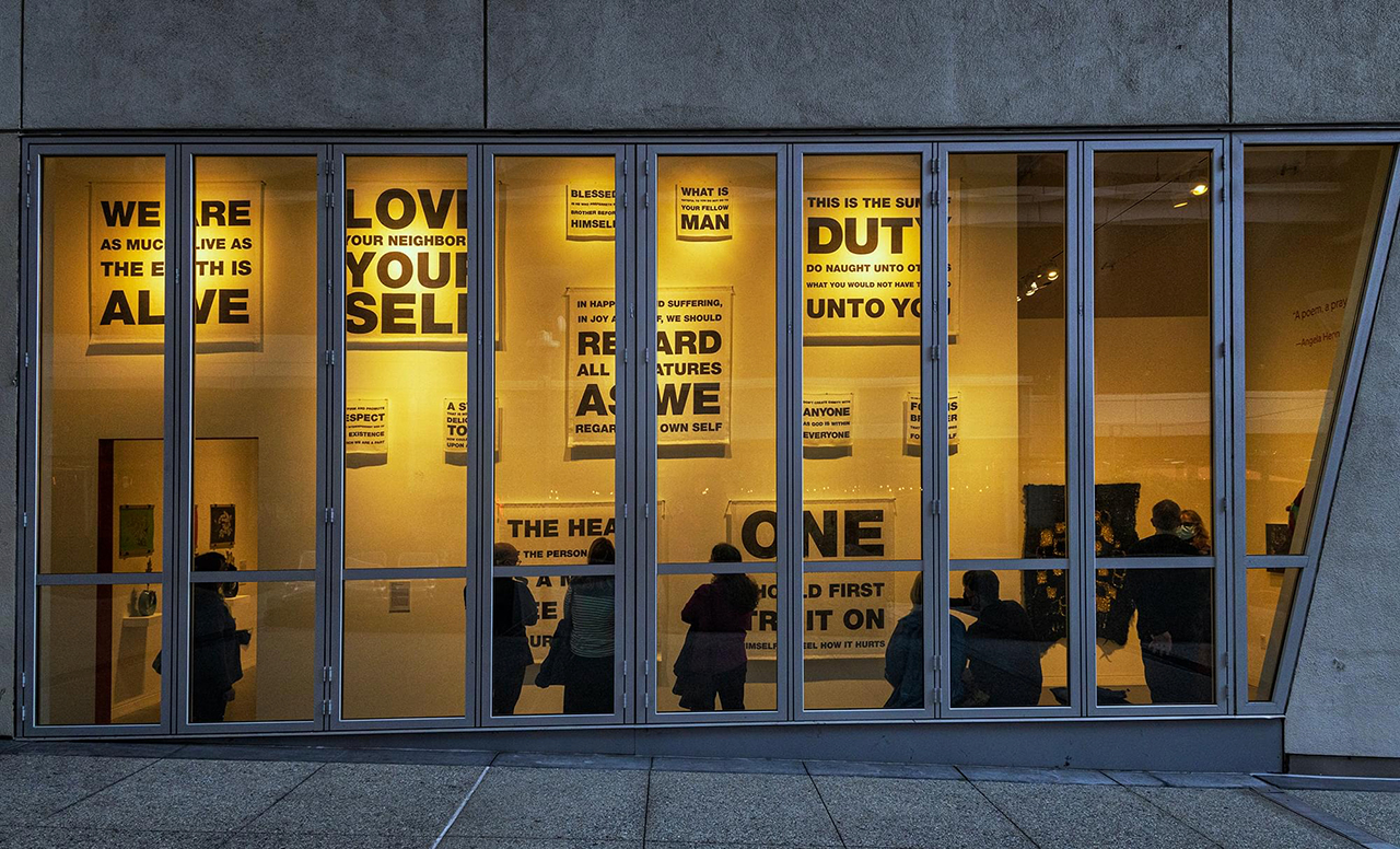 Artist Beth Grossman's "Golden Rule," part of the exhibit "Tikkun: For the Cosmos, the Community, and Ourselves," seen through the windows of the Contemporary Jewish Museum in San Francisco (Kevin Fyer)