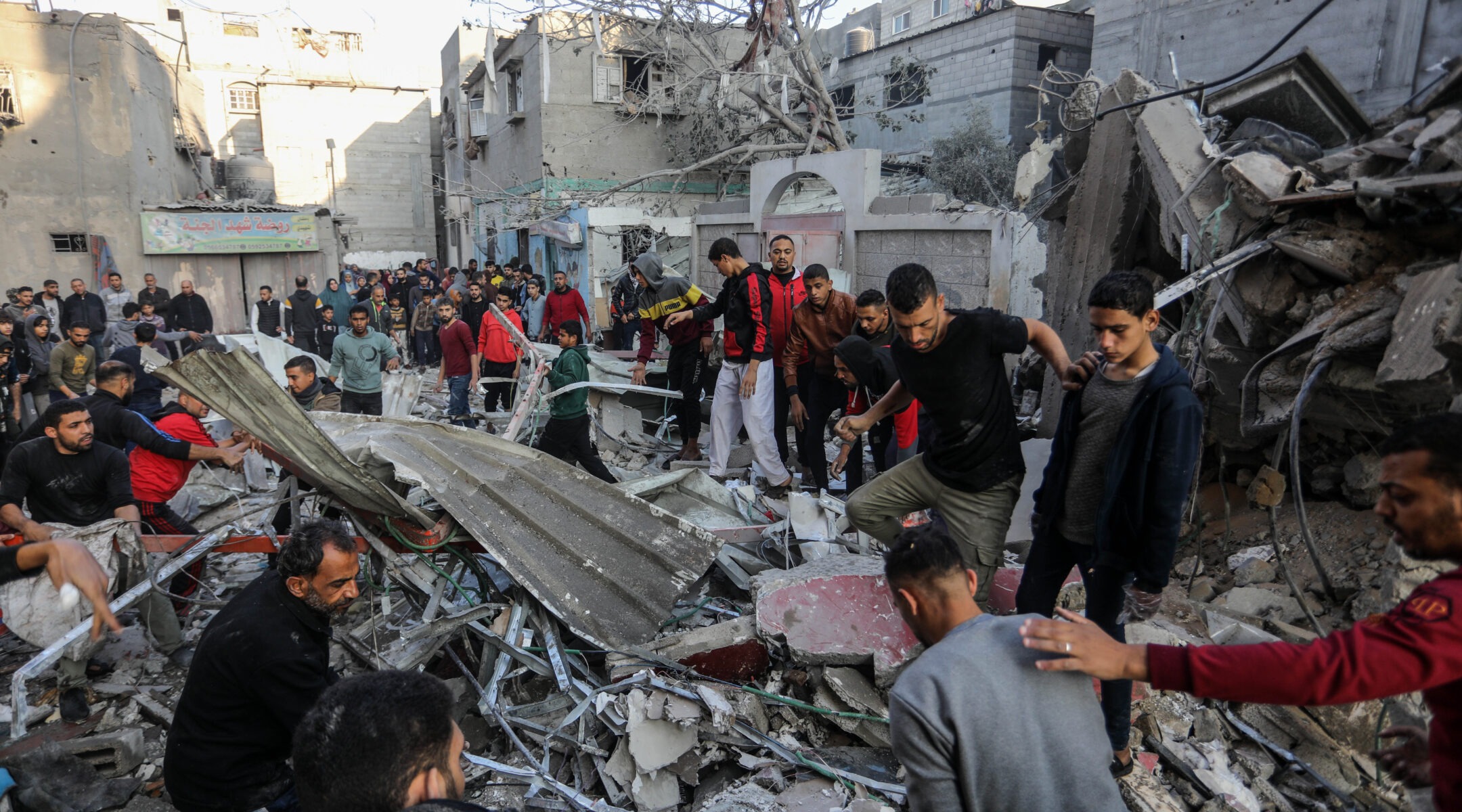 Palestinians look for survivors after an Israeli airstrike on a house belonging to the Adwan family in Rafah in the southern Gaza Strip, Dec. 1, 2023. (Abed Rahim Khatib/dpa via Getty Images)