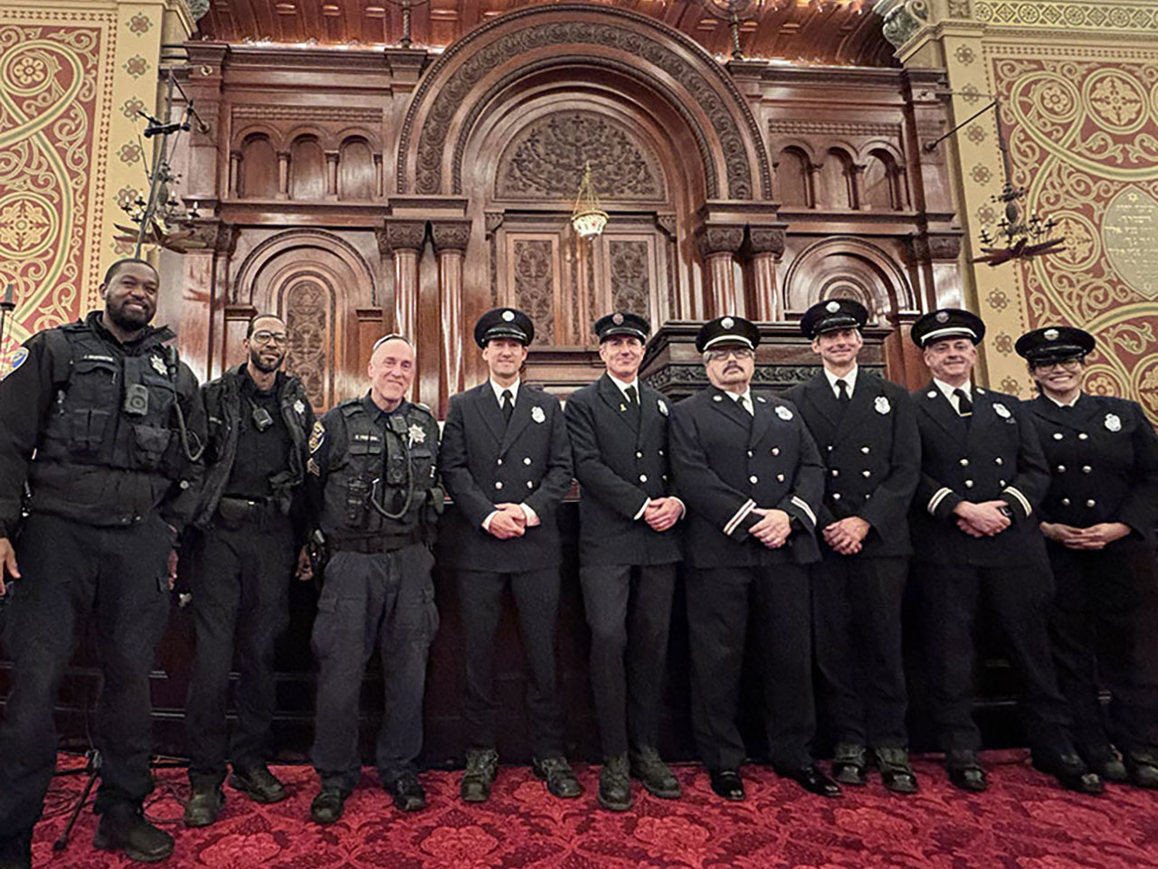 Members of the SFFD Ner Tamid Society, as well as San Francisco police officers, visit Congregation Sherith Israel in San Francisco on Dec. 13. (Courtesy Alicia Kletter)