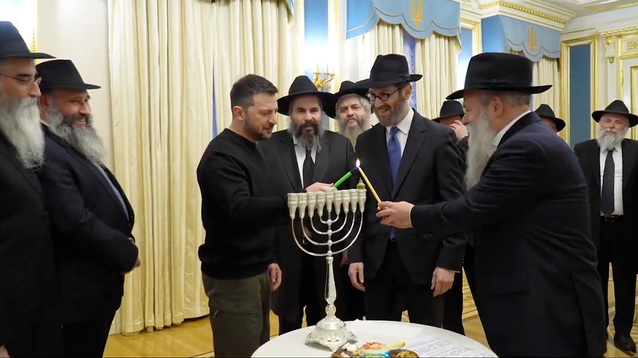 Ukraine's Volodymyr Zelensky lights a Hanukkah menorah in Kyiv on Dec. 25, 2024. (Screenshot)