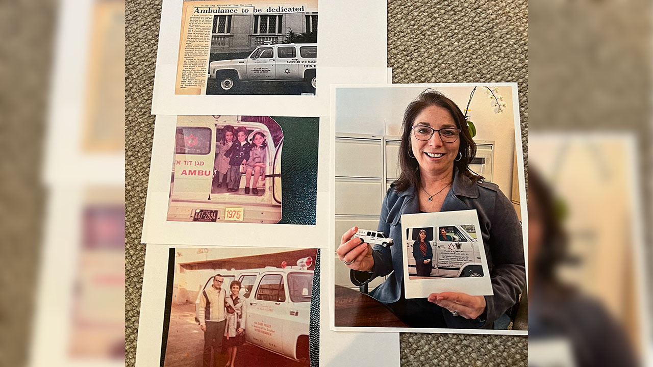Roxanne Cohen with photos of her family donating ambulances through the years. (Courtesy)