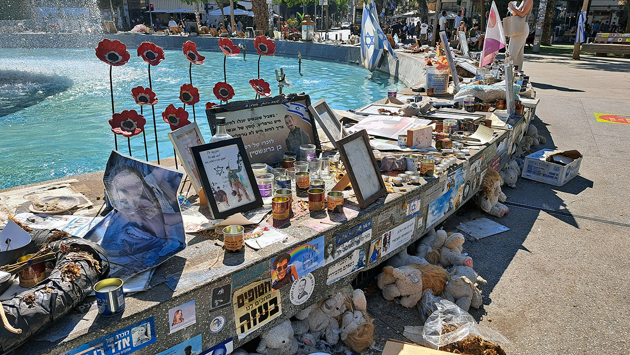 Tel Aviv's Dizengoff Square Fountain became a site to call attention to the hostages and honor the dead after Oct. 7, 2023. A year later, weather-beaten memorials mix with new ones for fallen soldiers, Oct. 20, 2024. (Natalie Weinstein/J. Staff)