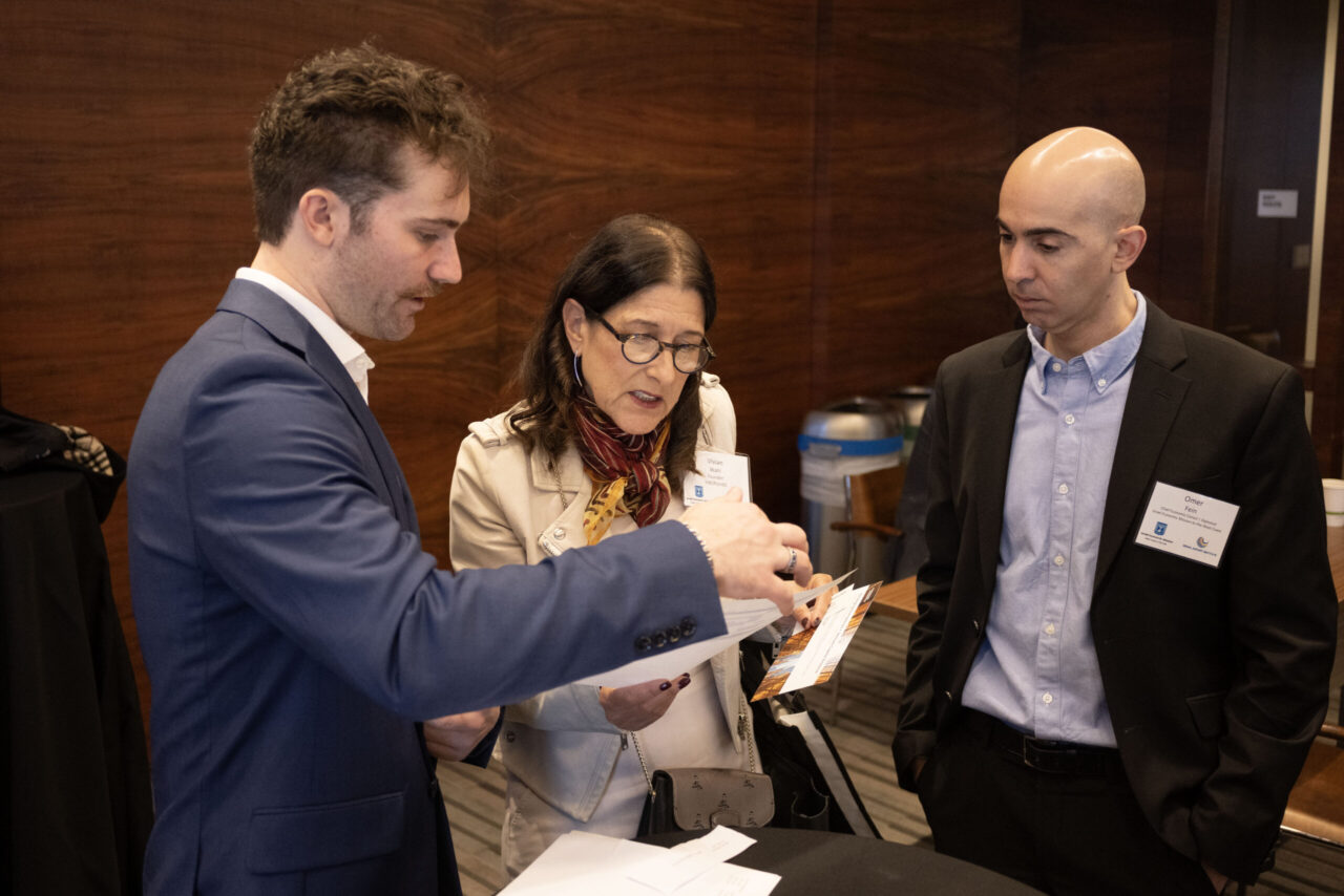 From left, Brett Super with the Israel Economic Mission to the West Coast, Vivian Wahl of VW2PointO, and mission head Omer Fein attend the startup showcase in San Francisco on Jan. 13. (Aaron Levy-Wolins/J. Staff)