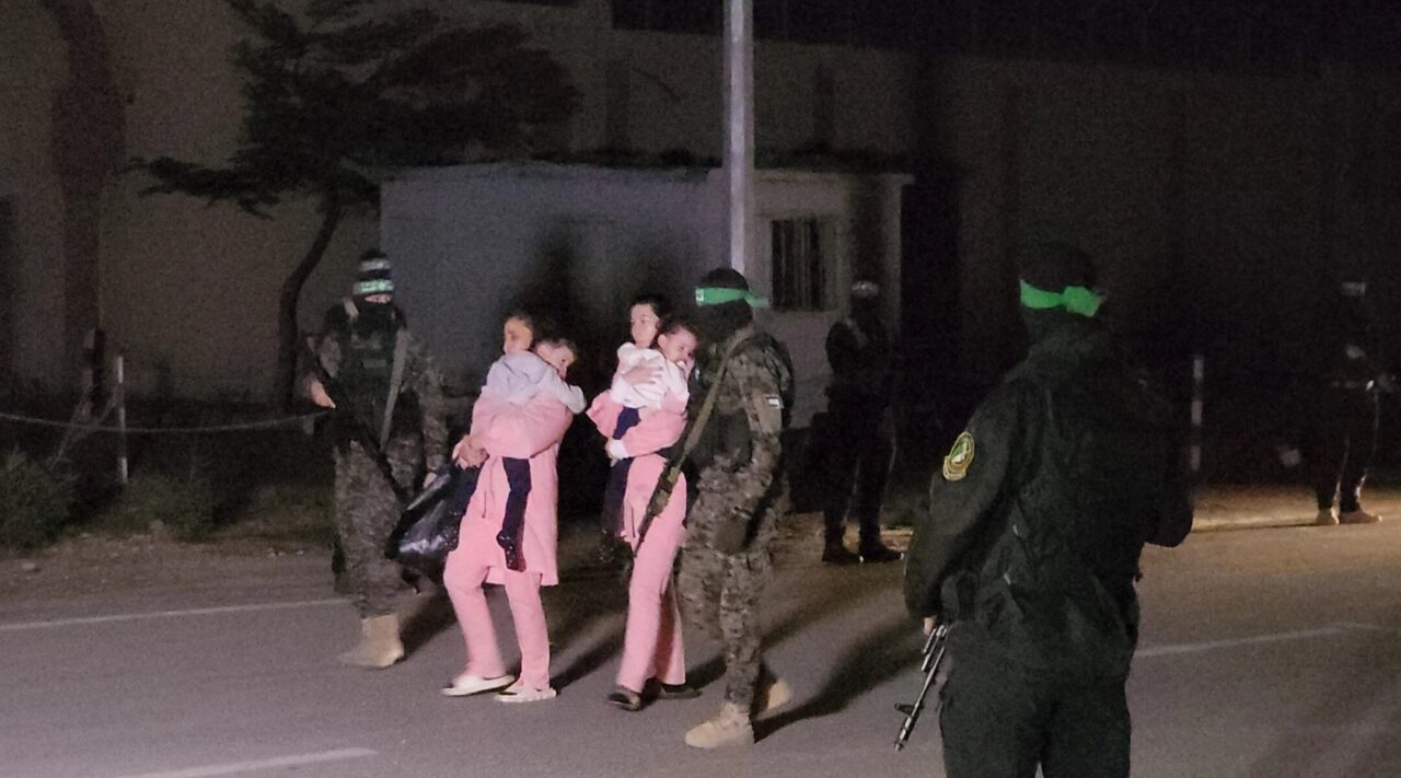 Hamas hands over Israeli hostages to the International Committee of the Red Cross in Gaza City, Gaza, on November 27, 2023. (Stringer/Anadolu via Getty Images)