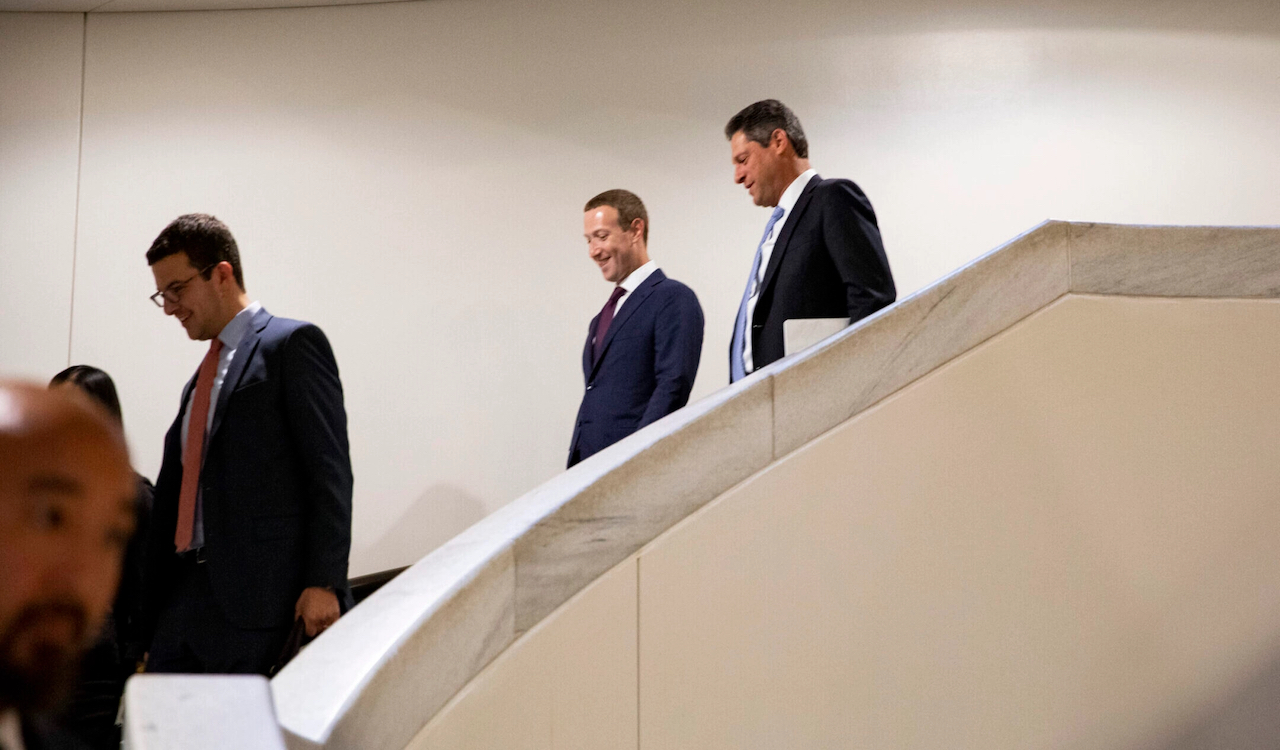 Meta founder and CEO Mark Zuckerberg, left, and Joel Kaplan, named in January 2025 as Meta's president of global affairs, descend a staircase after leaving a meeting with a Republican senator in Washington, D.C., Sept. 19, 2019. (Samuel Corum/Getty Images)