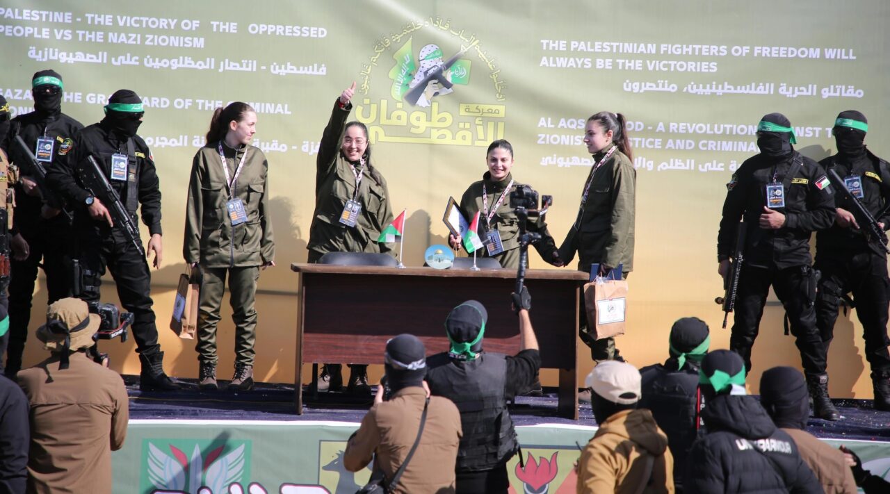Four young women on a stage