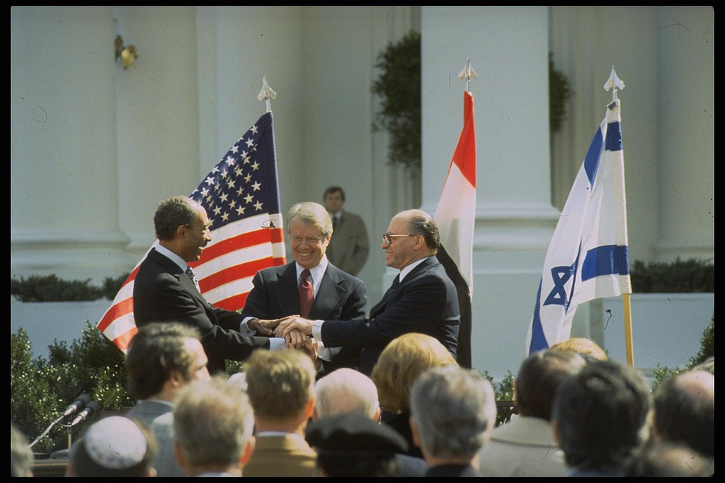 Three political leaders shake hands