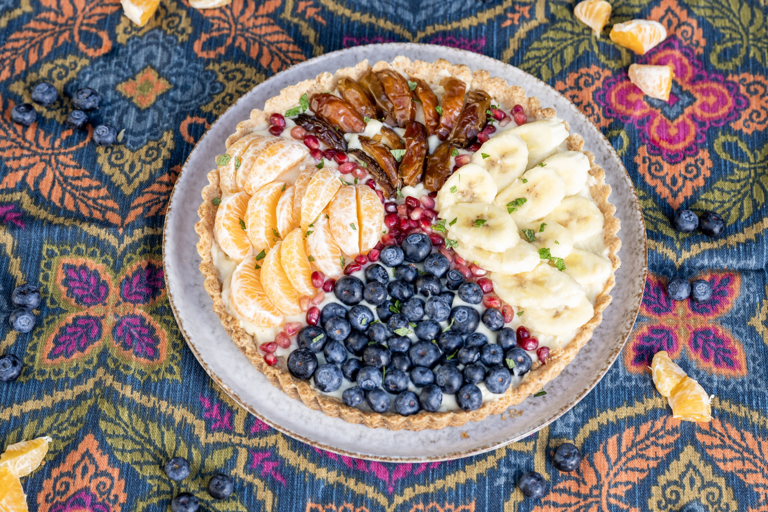 A fruit tart sitting on a table