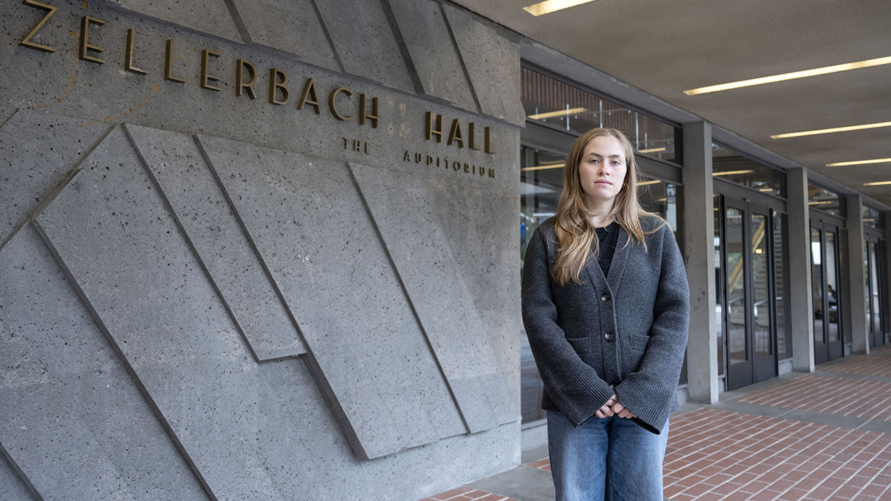 Shaya Keyvanfar, 19, stands in front of UC Berkeley's Zellerbach Hall nearly one year after she watched a friend get "strangled" while attempting to keep protesters from storming Zellerbach's Playhouse. (Aaron Levy-Wolins/J. Staff)