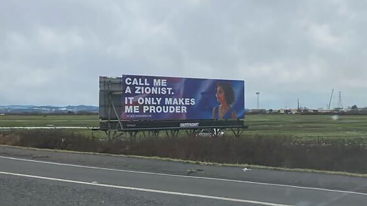 a billboard on a rural highway says "call me Zionist. It only makes me prouder"