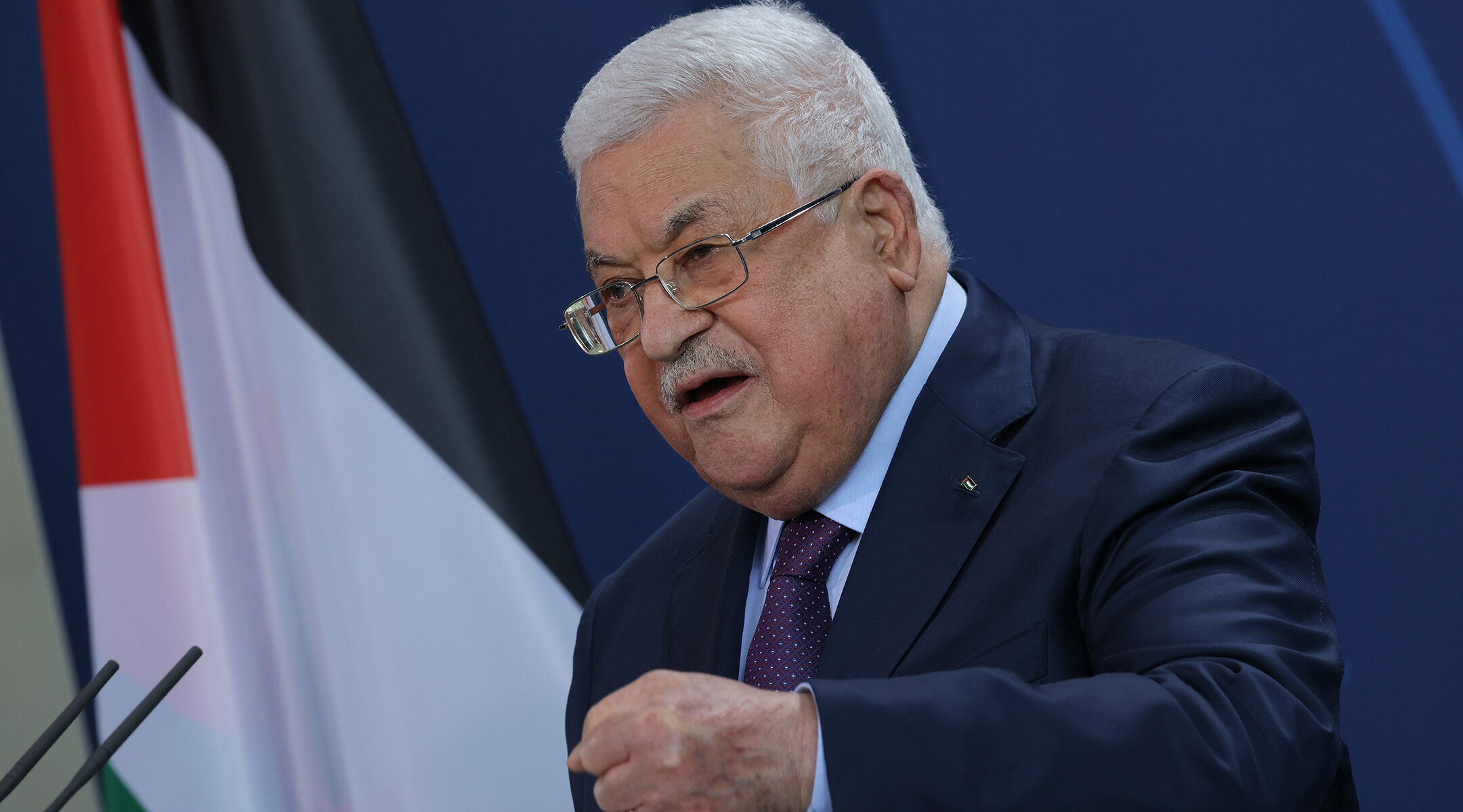 Abbas speaks at a lectern
