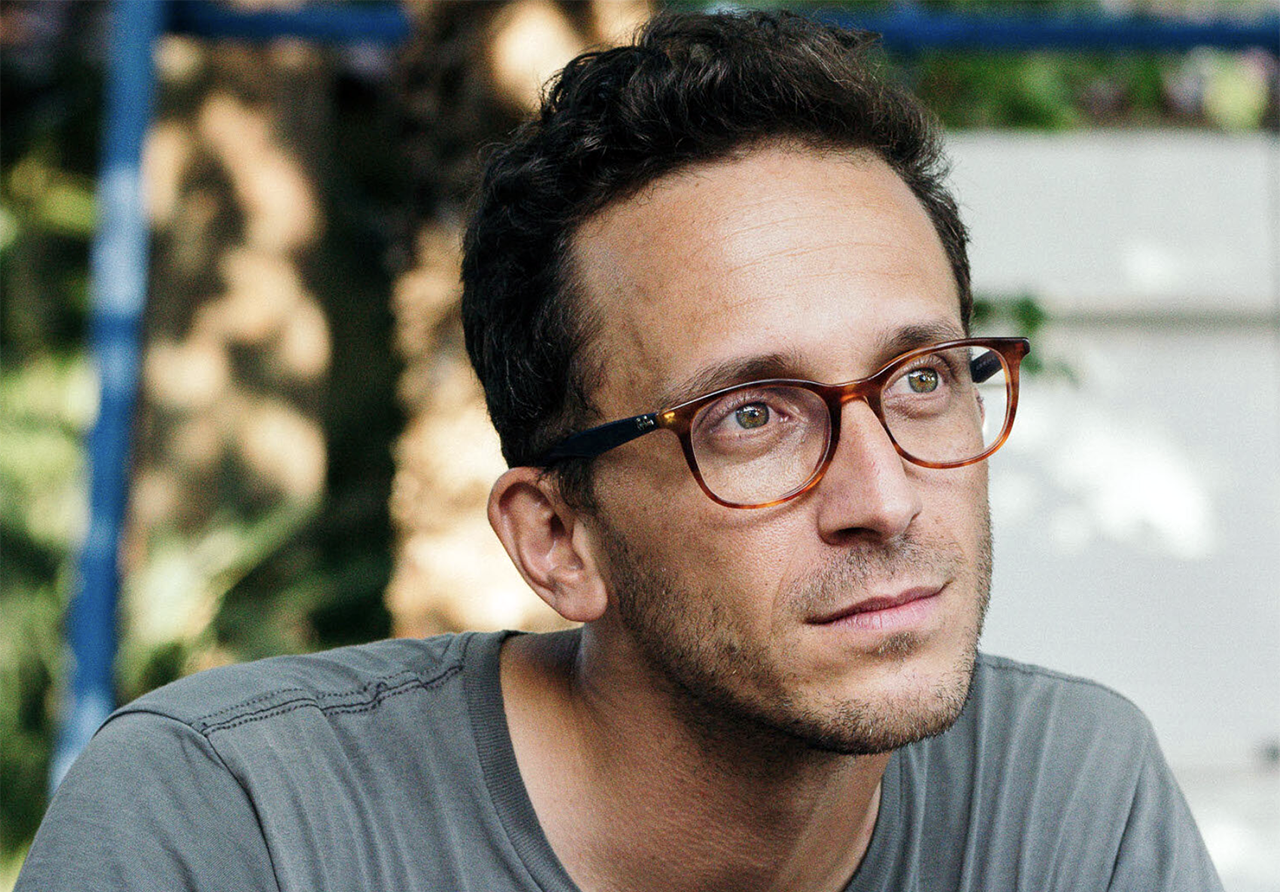Portrait of a young-ish man in glasses