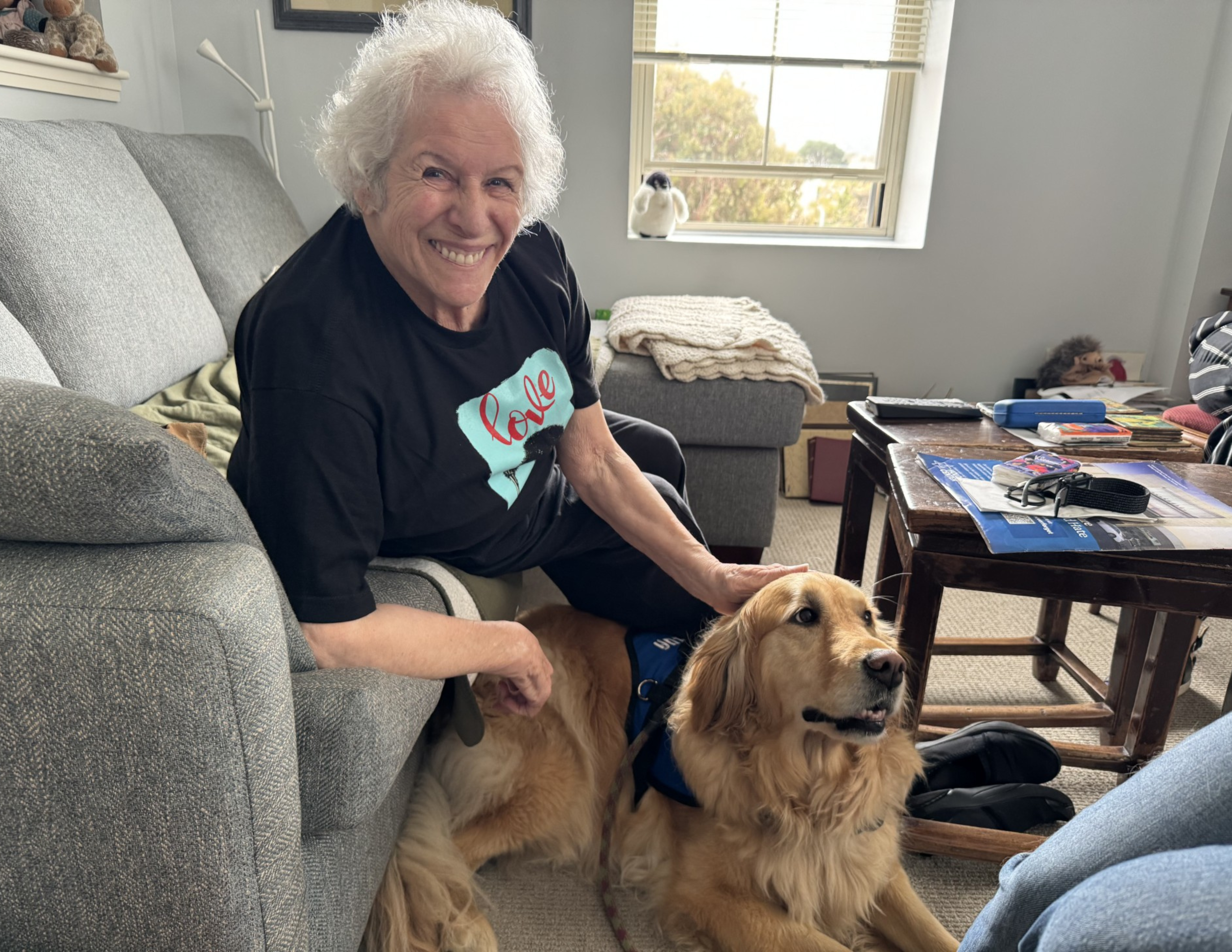 Sharon Herman with her dog visitor, Malua. (Courtesy)