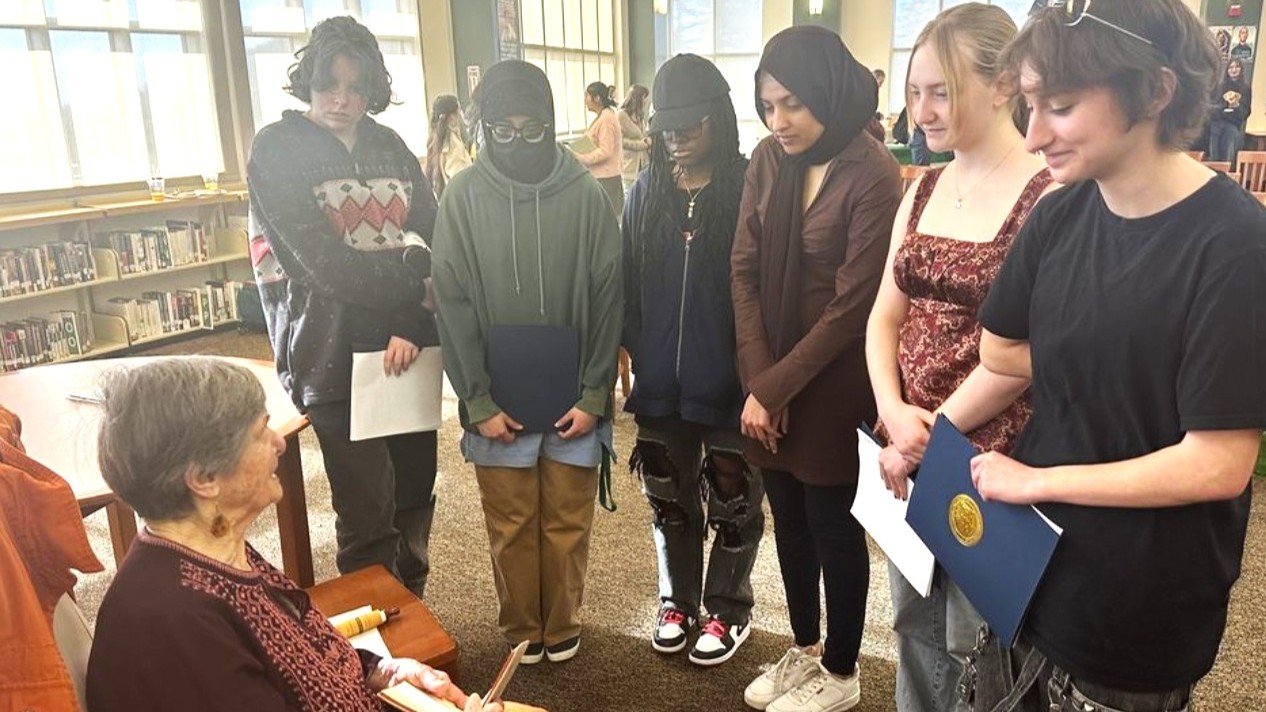 Holocaust survivor and students
