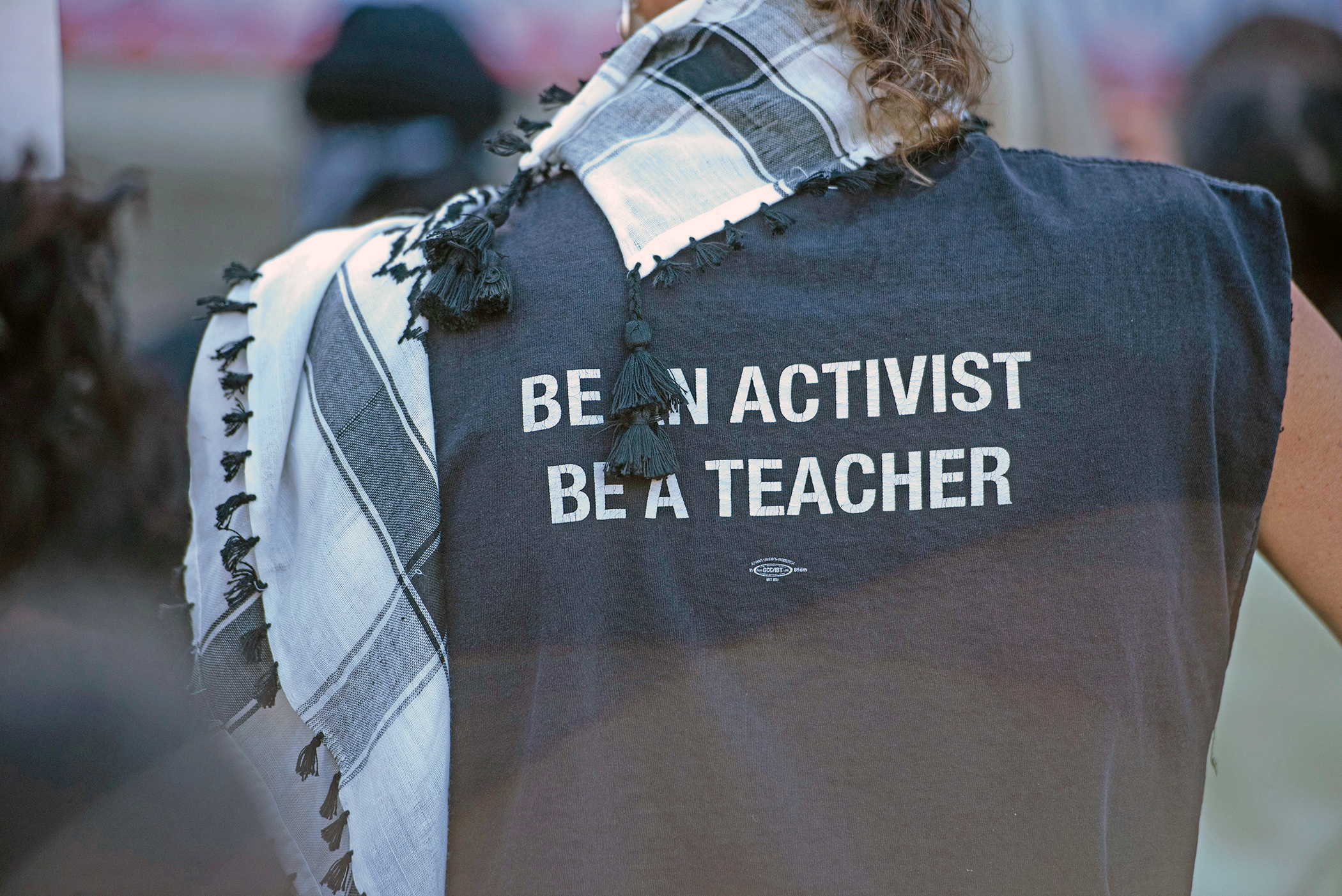 "Be an activist, be a teacher," reads a T-shirt at an educators rally in Berkeley in May of 2024. (Aaron Levy-Wolins/J. Staff)