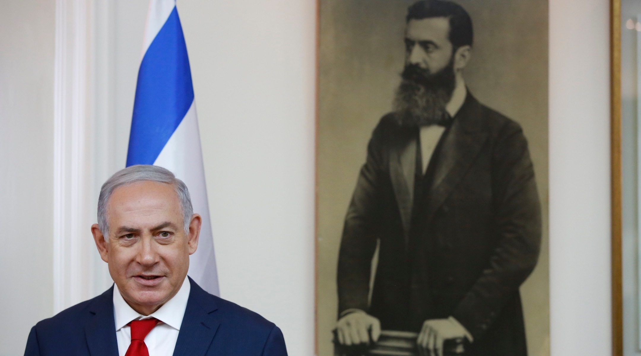 Israeli Prime Minister Benjamin Netanyahu is seen before a portrait of Theodor Herzl, known as the "Visionary of the Jewish State" and the founder of modern Zionism in Jerusalem on May 2, 2018. (Abir Sultan/Pool/AFP via Getty Images)