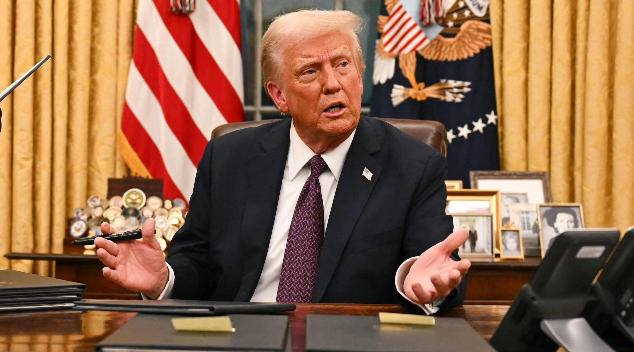 President Donald Trump speaks to journalists in the Oval Office on January 20, 2025. (Jim WATSON/ POOL/AFP)