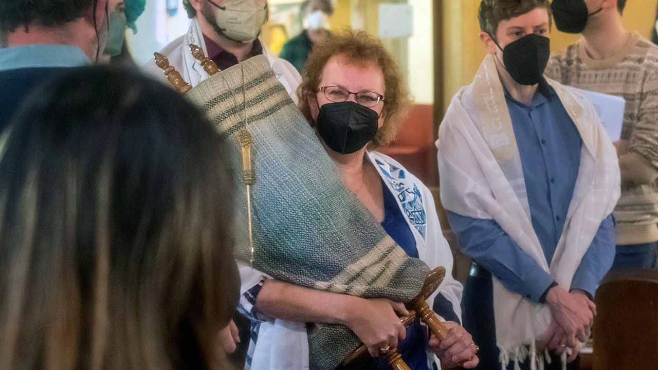 Rachele Kanigel carries the Torah at her bat mitzvah. (Kim Komenich)
