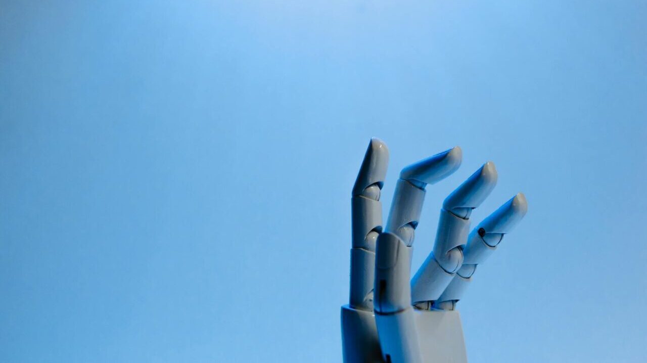 robot fingers on blue background