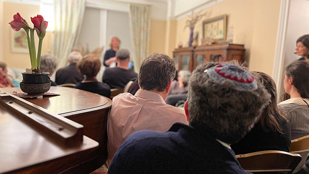 An audience of observant Jews listens to a talk by Israeli legal scholar Karin Loevy at a private apartment on New York's Upper West Side, Feb. 26, 2025. (JTA photo)