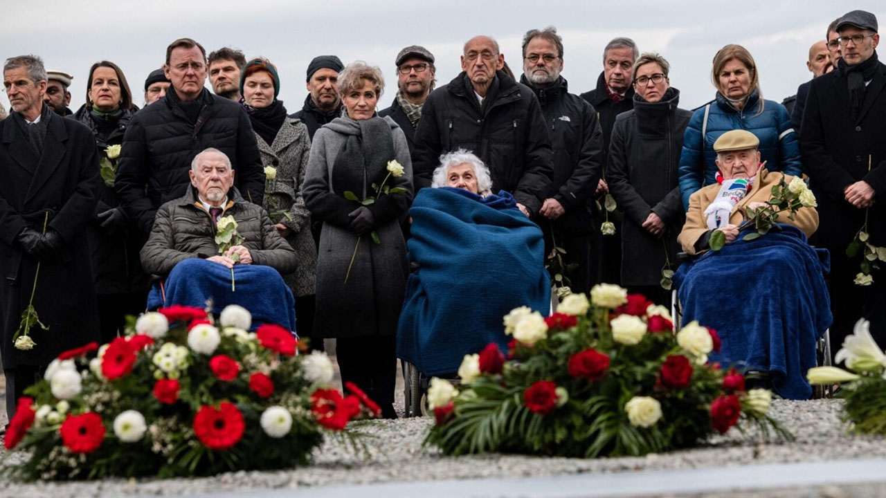 Holocaust survivors (from left) Guenter Pappenheim, Eva Fahidi-Pusztai and Heinrich Rotmensch sit in wheelchairs at a ceremony at the Buchenwald concentration camp on Jan. 27, 2020, the 75th anniversary of the liberation of Auschwitz. All three died before the 80th anniversary. (Jens Schlueter/AFP via Getty Images)