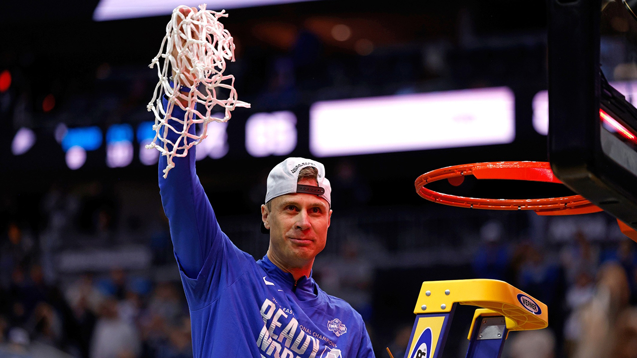 Head coach Jon Scheyer of the Duke Blue Devils celebrates after cutting the net following a victory against the Alabama Crimson Tide in the Elite Eight round of the men’s NCAA basketball tournament on March 29, 2025 in Newark, New Jersey. (Lance King/Getty Images)
