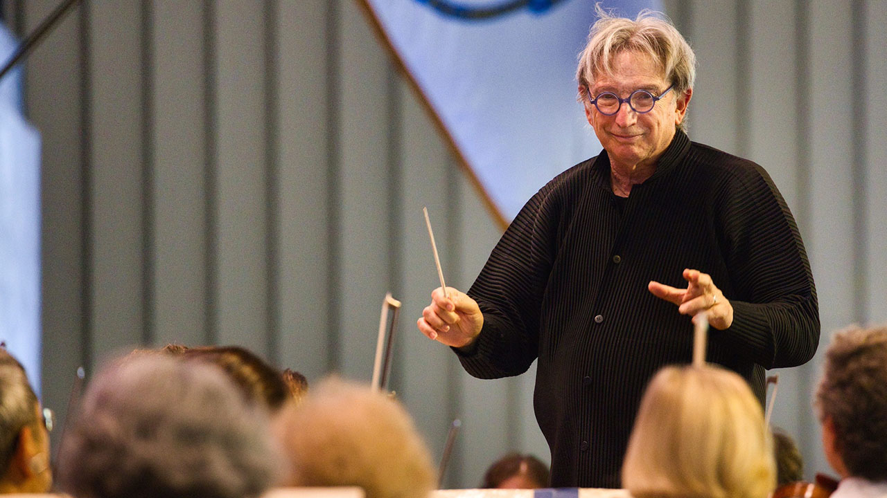 Michael Tilson Thomas conducting the Boston Symphony Orchestra at Tanglewood, in Beethoven's 9th Symphony, the Ode to Joy, on August 28, 2022. It was Tilson Thomas's last concert with the BSO, where he began his career in 1969, as its assistant conductor and pianist. (Hilary Scott/Courtesy Boston Symphony Orchestra).