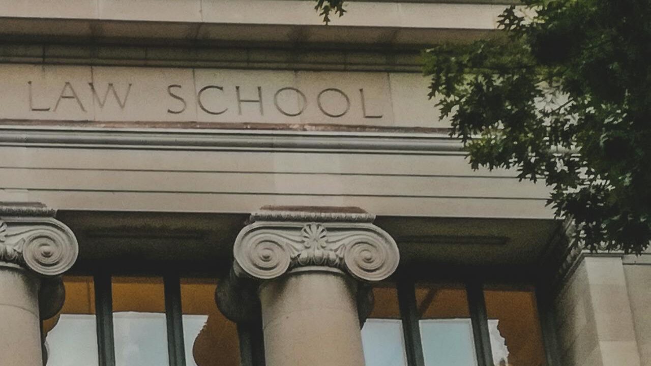 Classical architecture of Harvard Law School's facade with iconic columns, perfect for educational themes.