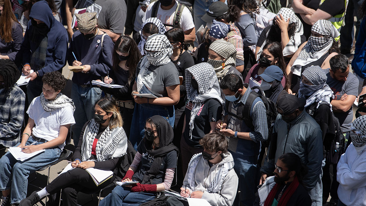 Student activists, many wearing kaffiyehs, attend a public negotiation session between San Francisco State University administrators and students who demand that the university divest from companies that do business with Israel on May 6, 2024. (Aaron Levy-Wolins/J. Staff)