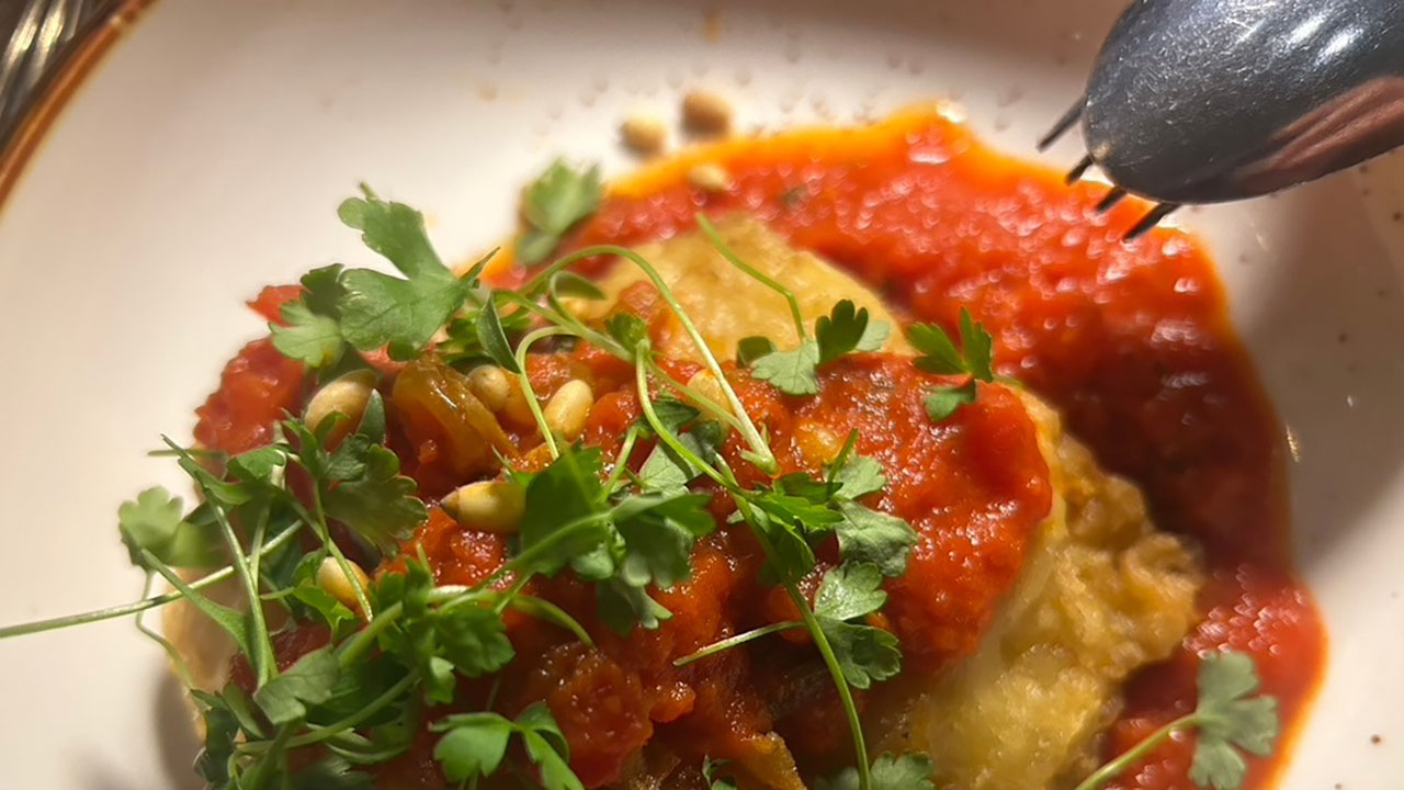 Deep fried salt cod in tomato sauce