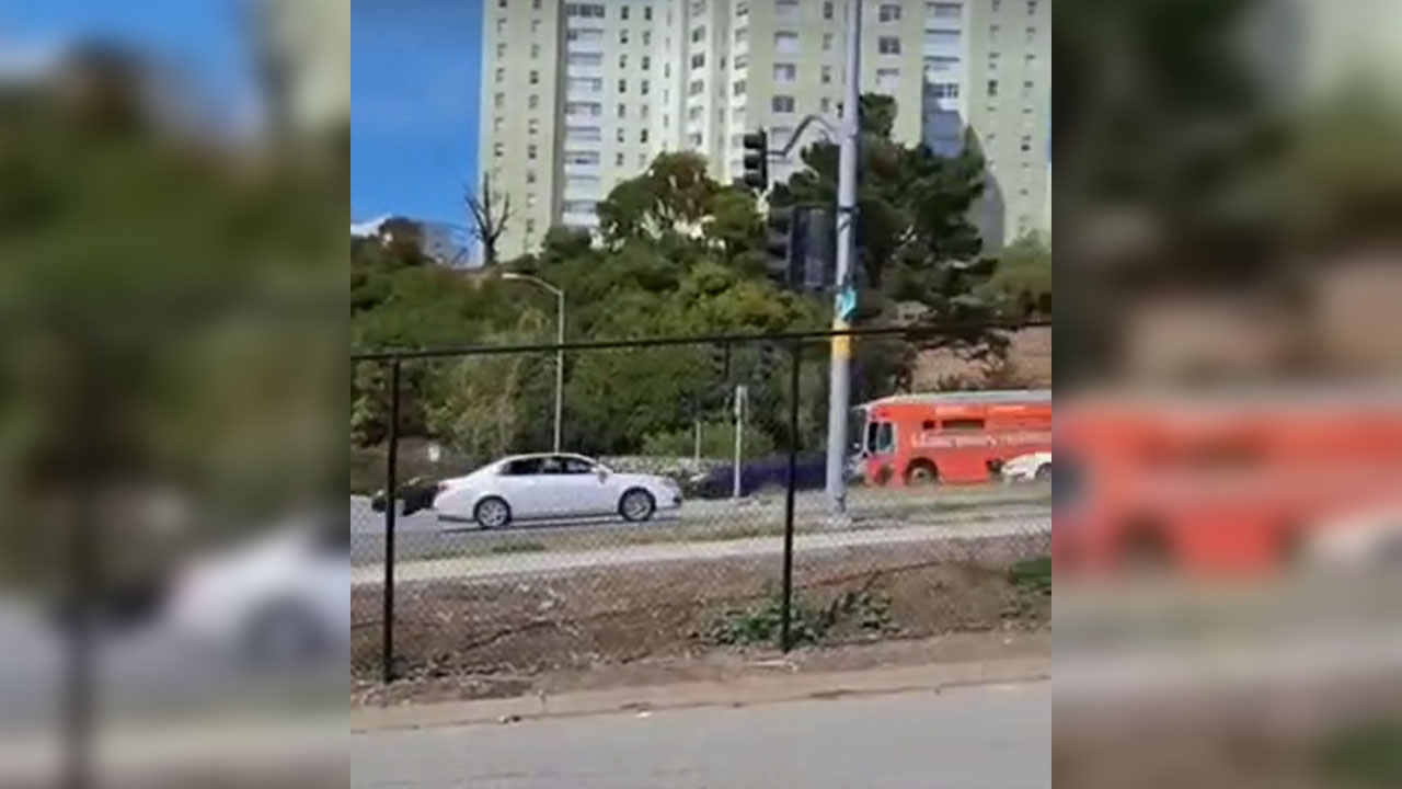 Screenshot from a video taken by a Brandeis School staff member of a man in a white sedan shouting "f**k Israel" as he drives past a student and her mother on Brotherhood Way in San Francisco. (Courtesy)