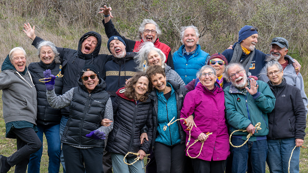 Participants in From Older to Elder's February 2025 retreat mug for the camera at Point Reyes National Seashore. (Courtesy Bruce Beron)