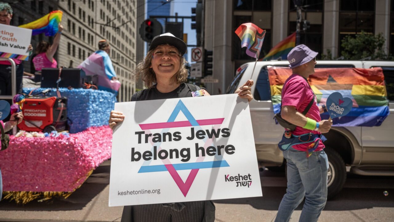 A person holds a “Trans Jews belong here” sign at the 2025 San Francisco pride parade. (Aaron Levy-Wolins/J. Staff)