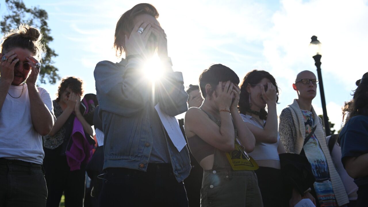 At a Shabbat ritual and picnic before the Trans March in 2023, Jews recite a blessing at Dolores Park in San Francisco. (Aaron Levy-Wolins/J. Staff)