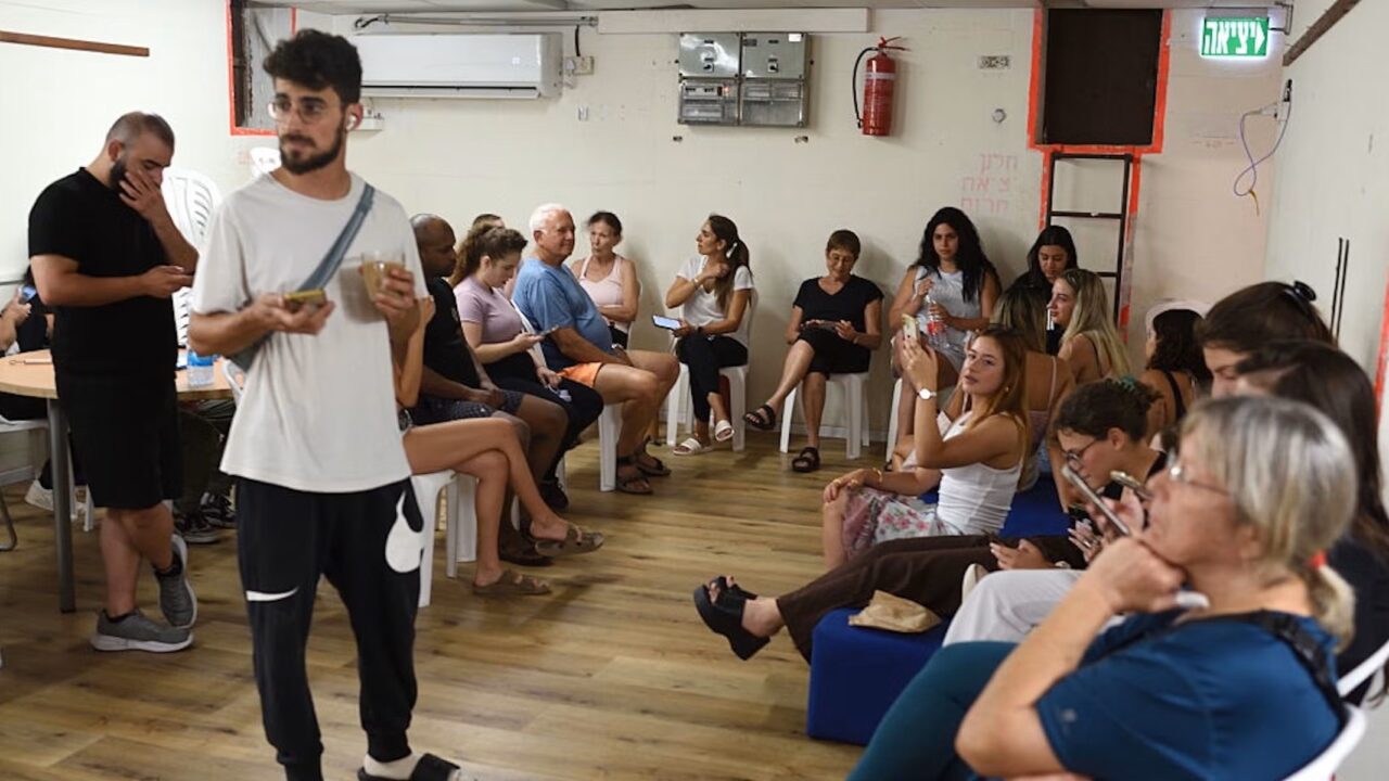 Israeli students take shelter inside a public bomb shelter during a ballistic missile barrage launched by Iran toward Israel at the Rupin Academic Centre, north of Tel Aviv, on June 17, 2025. (Gili Yaari/NurPhoto via Getty Images)