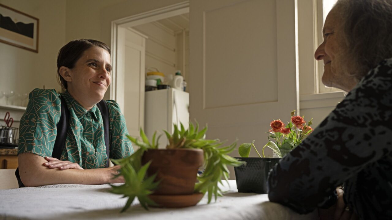 two women sit together