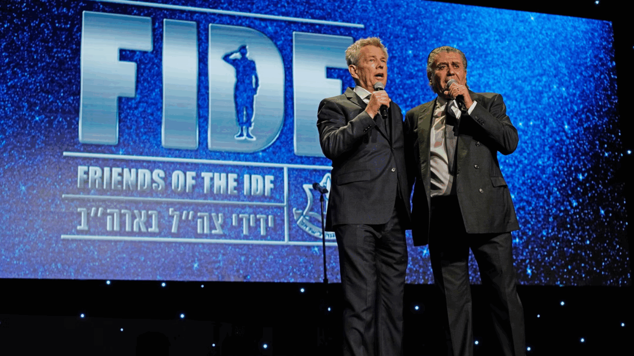 David Foster, left, and Haim Saban speak onstage